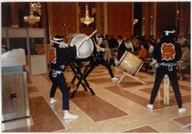 SCENE: ARAISHI DAIKO PERFORM TAIKO DRUMMING AT REDRESS RALLY.