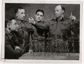 Photo of Canadian soldiers learning to lay barbed wire at McGill