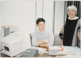 GROUP PORTRAIT: REI AT A DESK
